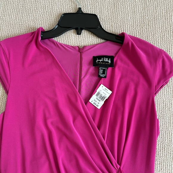 Dress hangs great. Never worn. Ruffles in front and bottom - Picture 3 of 9